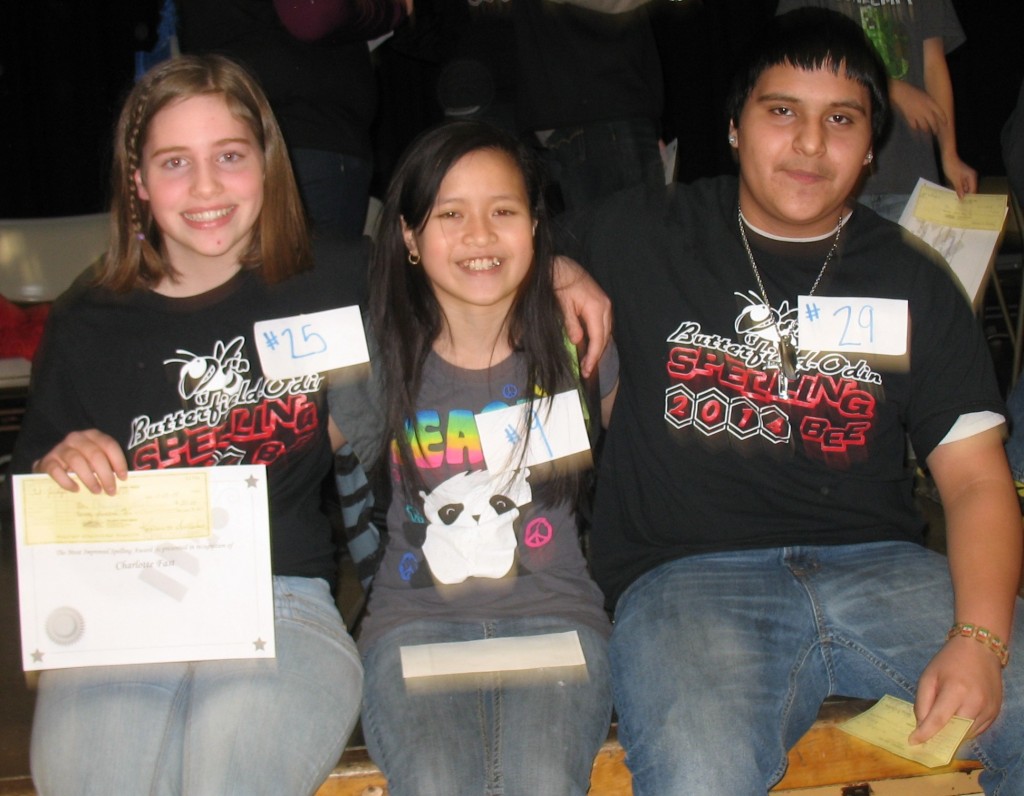 THE 2014 BUTTERFIELD-Odin Public High School Scripps National Spelling Bee winners. Champion Kaliana Xayaphonesongkham, center is surrounded by second-place Jorge Herrera, right and Charlotte Fast, third-place finisher, left.