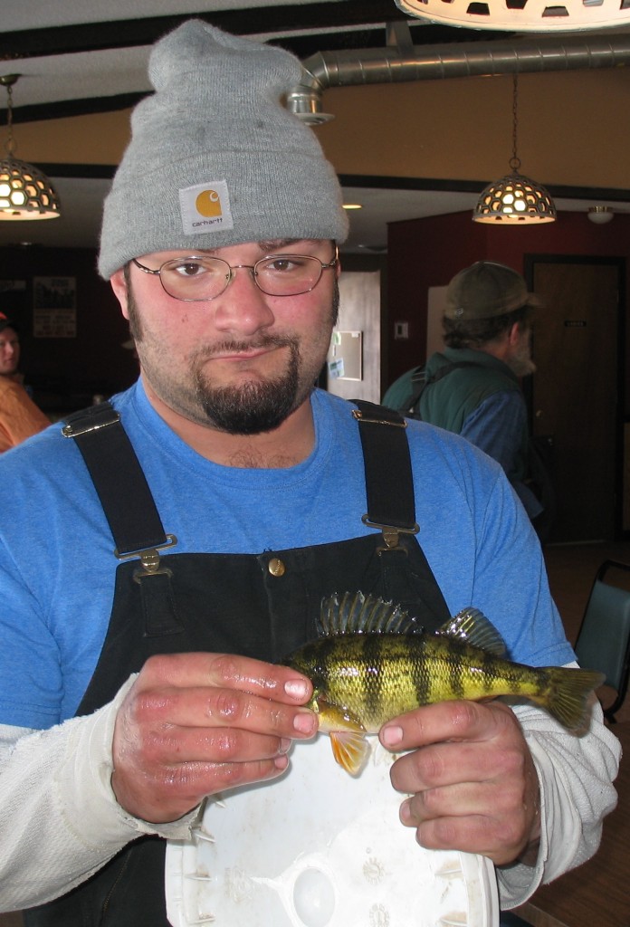 NIK SAMUELSON OF Butterfield brought Emily Bentson's bass into the Mountain Lake Golf Course Club House for weighing. The catch weighed in at .26 lb.