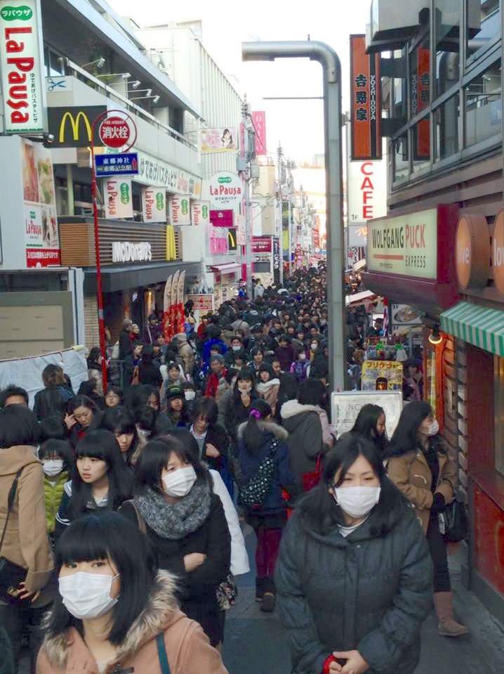 A PHOTO TAKEN in January at Harajuku, Japan by Doug Wiens. Notice two blonde heads under the McDonald's sign - Doug's wife Deb and daughter, Julia. The crowds are wearing masks due to illness.