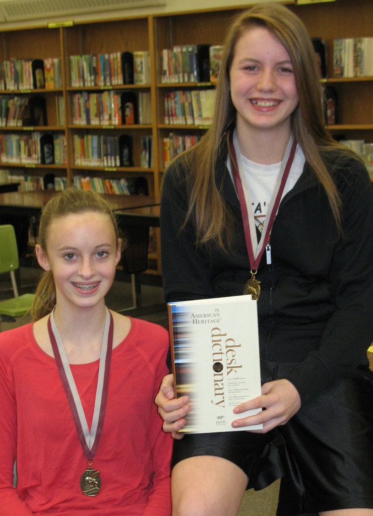 SEVENTH-GRADER MAURISSA Isaacs, right, made it a repeat, winning the 2014 Mountain Lake Public School Spelling Bee. She was the 2013 champ and runner-up in the Regional Bee. Runner-up at the local Bee was eighth-grader Jae Faber, left.