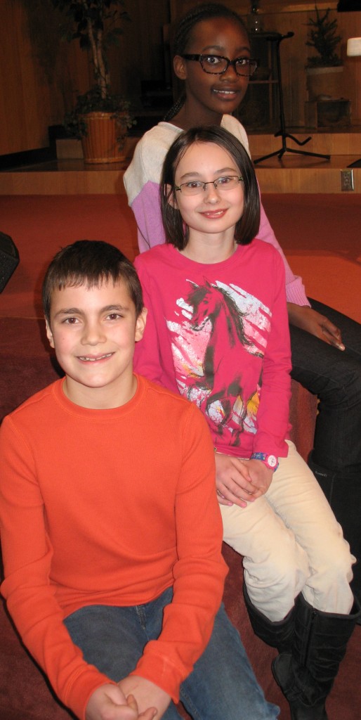 FIFTH-GRADE'S top spelling trio. From back-to-front, Kimberly Mugaisi, first; Sara Quiring, second and Jack Lepp, third. 