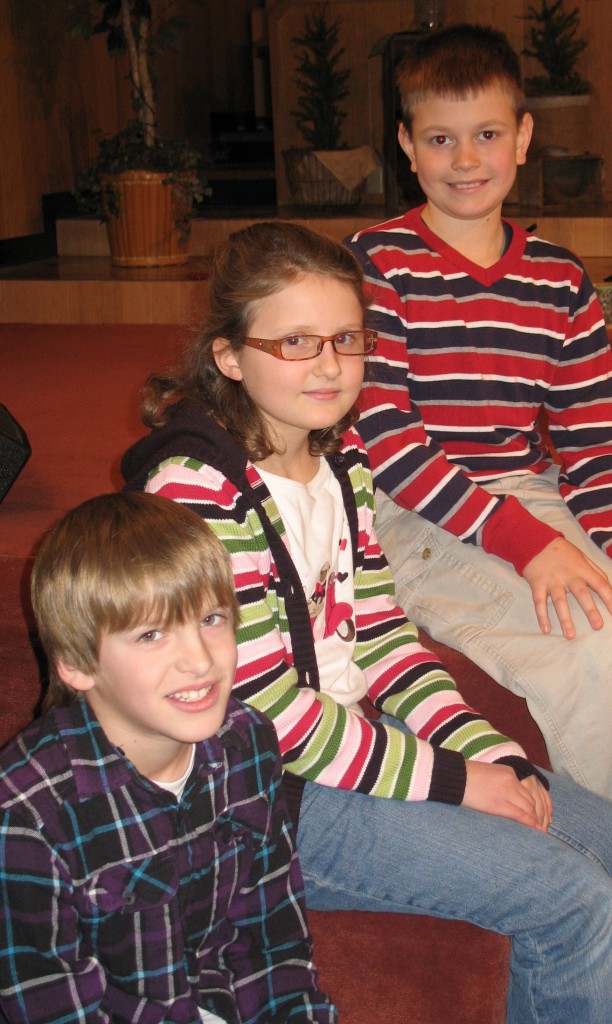 TOP TRIO OF fourth-grade spellers. From top-to-bottom, Ian Penner, first; Miriam Rete, second and Drayton Klassen, third.