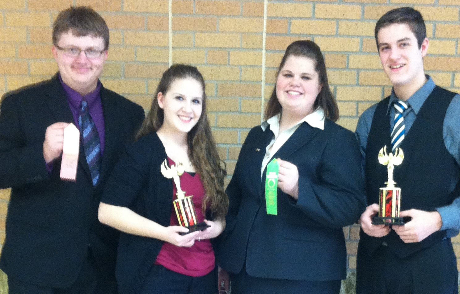 FOUR MLC ORATORS earned awards this past Saturday at the Worthington Trojan Invitational Speech Meet. From left, James Hamm, Melissa Lohrenz, Caitlyn Smith and Josh Raabe.