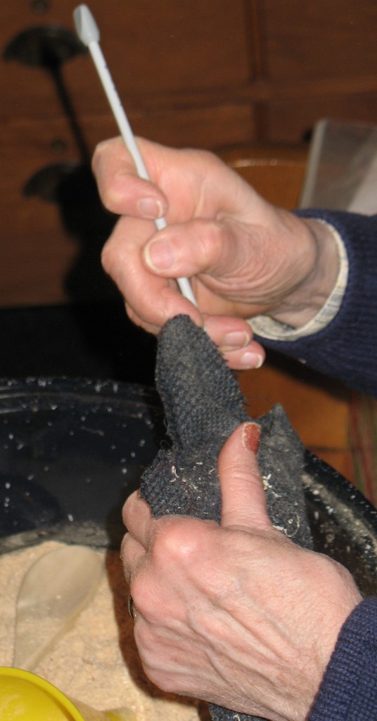 A KNITTING NEEDLE can be used to force the sawdust through the funnel into the star, where the filler will be packed full into all areas.