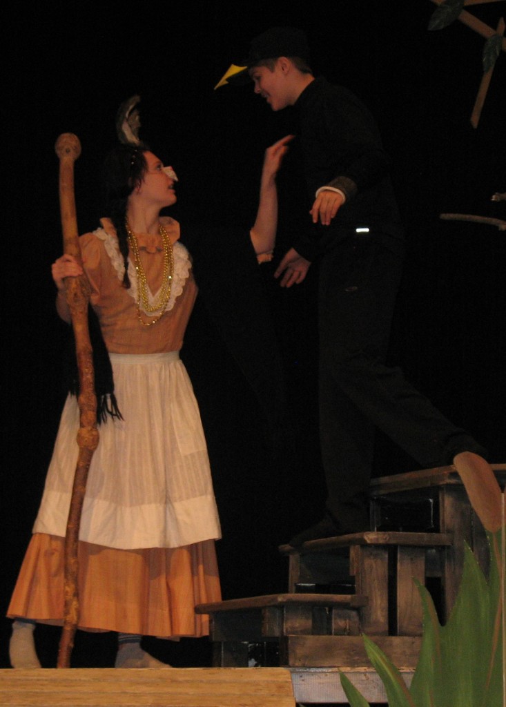AUNT MAMMY-BAMMY (Lydia Hildebrandt), left, confronts Doc Crow (Regan Syverson), right - calling him a quack.