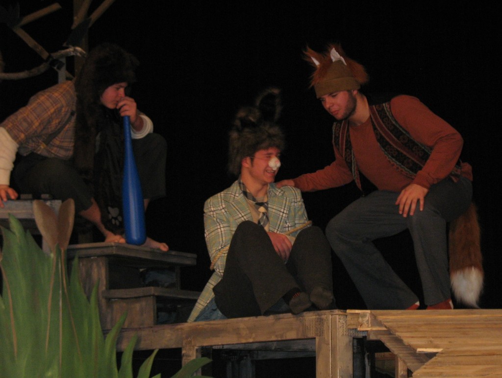 BRER RABBIT (BEN Grev), center, tied up by Brer Bear (Sam Grev), left and Brer Fox (Josh Grev), right, convinces the pair to let him show them where he "gets his funnies" - stalling in order to escape their plans of eating him,