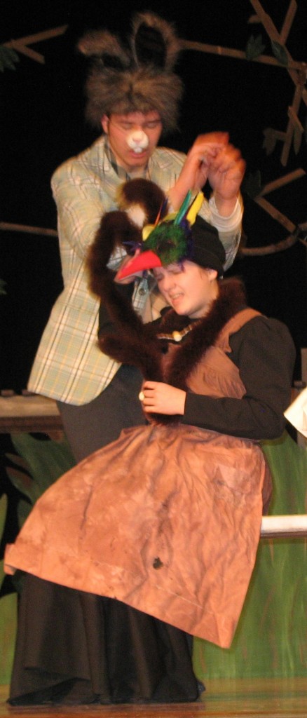 BRER RABBIT (BEN Grev) grabs a handful of feathers from the head of Sis Buzzard (Kalley Rempel) - needed by Aunt Mammy-Bammy to make a potion to help Brer Rabbit cure "de Mopes."