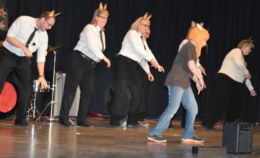 A SPECIAL GROUP of staff members - along with their lead, the Fox, fourth-grade student Sam Stade, front, share their version of the popular YouTube video, "The Fox." Backing Stade are, from left, ADDD