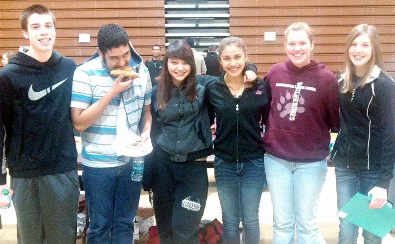 SIX MOUNTAIN LAKE Public High School vocalists who recently attended the annual Concordia Music Festival enjoyed some pizza upon their arrival in Moorhead, Minnesota. From left, Ryan McCue, Ruben Fentanez, ?? Kassandra Tellez, Kenna Gardiner and Lexia Peters.
