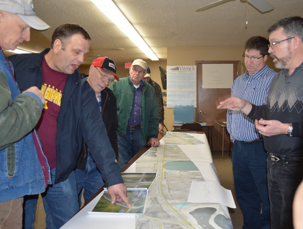AT LEFT, BINGHAM Lake area farmer Duane Harder discusses the reduced conflict intersection proposal with Minnesota Department of Transportation representatives at right, Scott Morgan, hydraulics engineer, left and Steve Bowers, design engineer, right. Flanking Harder on either side are Rod Junker, left and Alvin Dick, right.