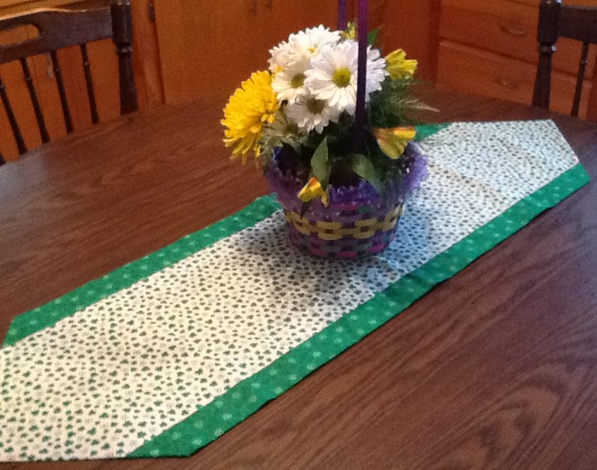 A HANDMADE SPRING table runner.