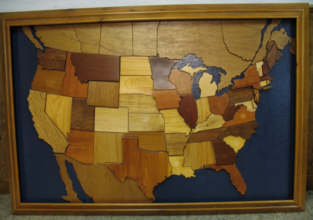 WOODEN MAP OF Minnesota featuring a variety of different woods and made by Lester Rupp of Mountain Lake, Minnesota.