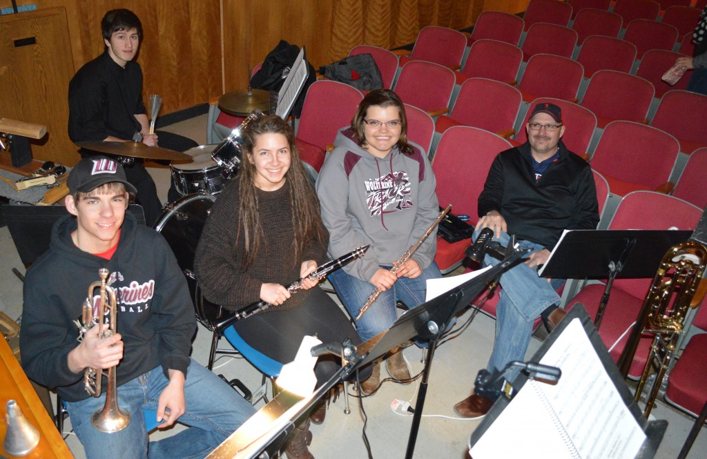 THE ORCHESTRA. FRONT, from left, Levi Jahnke on trumpet, Anna Engstrom on clarinet, Caitlin Oeltjenbruns on flute and Kurt Jahnke, orchestra director and trombone. Back, on drum set, Eric-John Niss. Missing is clarinetist Karen Soutthivong.