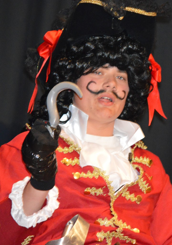 WHILE CAPTAIN HOOK (Dylan Hovdet) defends himself from the "anonymous" accusation of smelling like a cod fish . . .