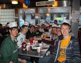 EATING AT ED Debevic's faux-diner. Identifiable are, at left, from left, Levi Jahnke, Julian Jung and Ethan Karschnik and at right, from front-to-back, Josh Fast, Caleb Rempel and Sam Grev.