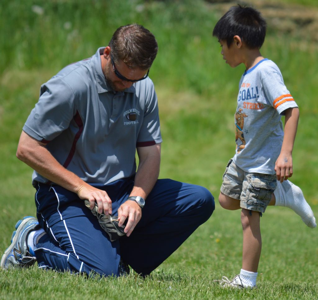 tim kirk and first grade student