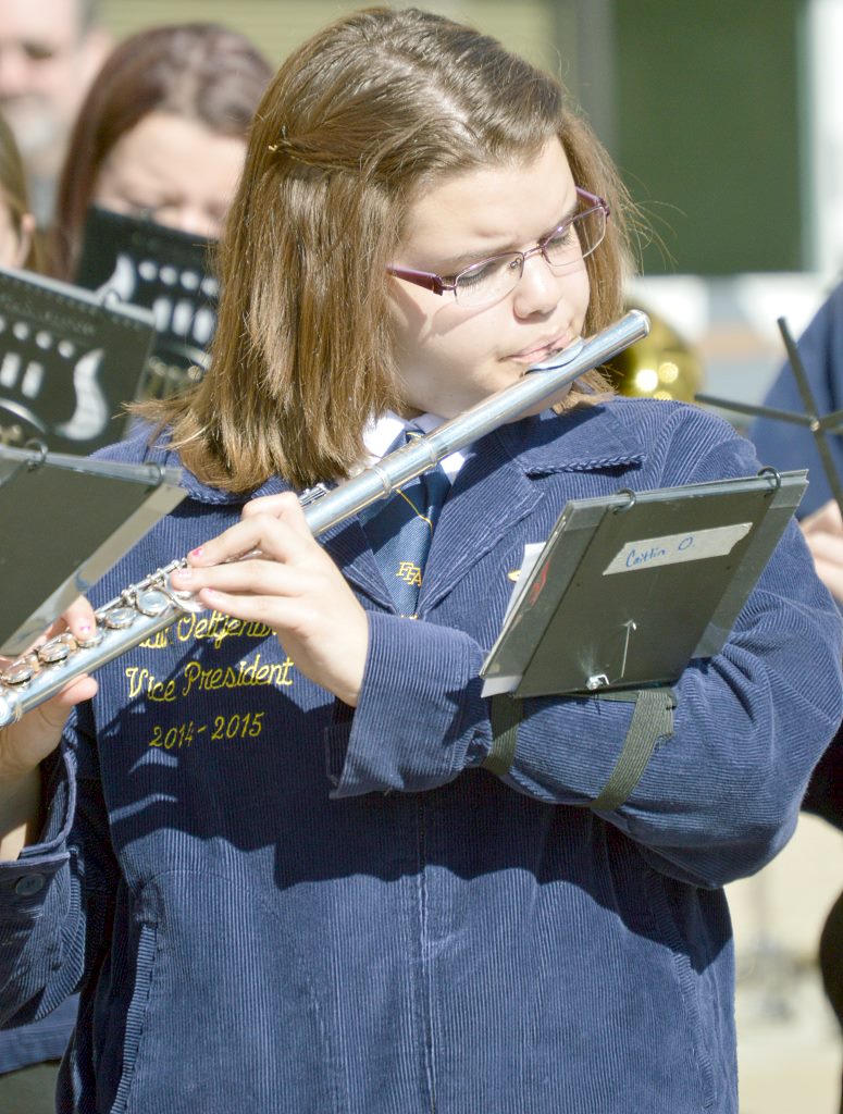 Caitlin Oeltjenbruns playing in National FFA Band on opening day of convention with their grand entrance
