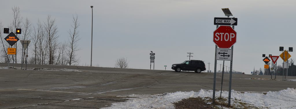 AS MOTORISTS TRAVELING north and south on Cottonwood County Road #1 at Mountain Lake approach the intersection with Minnesota Highway #60, they will be apprised by flashing signs noting "Traffic Approaching When Flashing" that there is traffic on #60 near the intersection. The warning sign system appears when at the stop sign preparing to cross the two two lanes of the four-lane highway, and again at the yield sign  as drivers get set to cross the second set of two lanes.