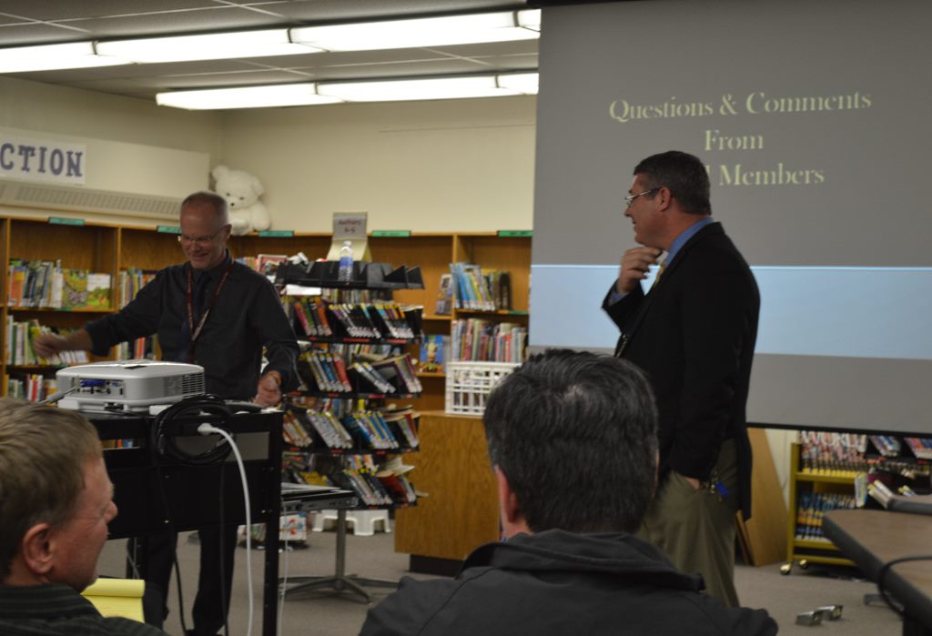 boards 2 MOUNTAIN LAKE PUBLIC School Superintendent Bill Strom, left and Windom Area Public School Superintendent Wayne Wormstadt, right, make their powerpoint presentation to their respective school boards and audience at the joint Tuesday evening, March 10 meeting in the Mountain Lake Public Elementary School library.
