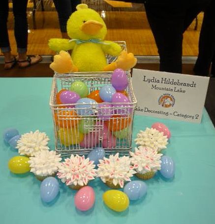 EASTER WAS THE theme for Lydia's Cake Decorating-Category 2 presentation, punctuated by her flower petal-like frosted cupcakes.