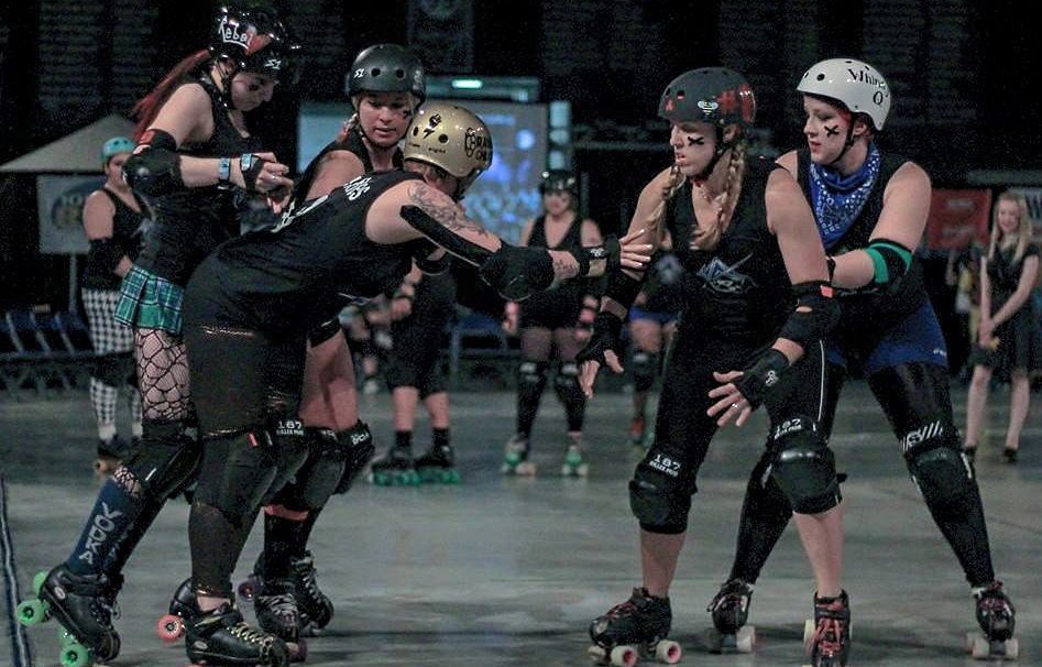  Second: Blocking a teammate while warming up at our home bout. (38th St Photography) 