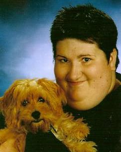 THE 200? MLHS graduation photo of Kelsey Hulzebos and her close canine companion, """"