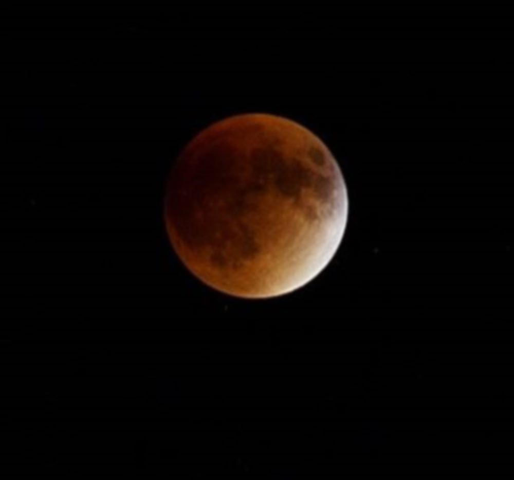 CLOSE TO ITS best look. However, the clouds moved in about 10 minutes before "peak time" and, for the most part, hung around through the remainder of the total eclipse.