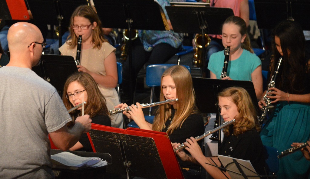 THE 7th- and 8th-Grade Band joined the elementary-age instrumentalists to present "Slide and the Family Bones," by Gerald Sebesky," a number that featured percussionists on five drum sets. At front, from left, flutists Emma Stade, Bileigh Anacker and Anika Fast. At back, from left, on clarinet, Hailey Marx, Sierra Perkins and Isabella Louangthilath. 