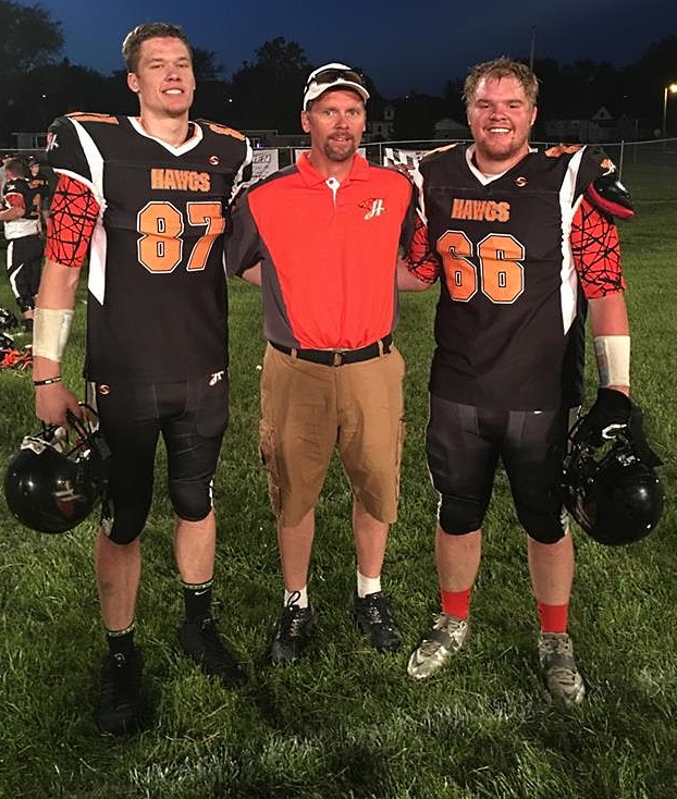 HAWGS' ASSISTANT COACH Tim Kirk, center, is sandwiched by his sons, South Central Hawg team members, Carter Kirk, left and Jordan Kirk, right. (Photo courtesy of Jordan Kirk)