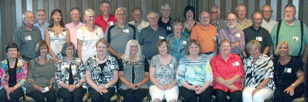 THERE WERE PLENTY of "golden" memories shared this past Saturday, June 18, when the Mountain Lake Public High School (MLHS) Class of 1966 helds its 50th Class Reunion. The event, held at the Hickory Inn in St. James, brought together 29 classmates of the 59 who graduated. Ten class members are deceased. Pictured above, front, from left, Elaine (Heide) Wedel, Shirley (Freitag) Berdan, Diane (Schroeder) Allman, Beverly (Foss) Wentworth, Dianne (Esau) Porter, June (Heinitz) College, Barb (Quiring) Jacques, Joanne (Hansen) TenKley, Mary Ann (Jungas) Casci and Jane (Doerksen) Jones. Middle, from left, Dean Winters, Glenda (Karschnik) Sinn, Kathy (Schriock) Mathistad, Kevin Dehmlow, Bob Ewert, Myrna (Dunker) Braun, Dave Bean, DeLyle Harries, Fred Wall and Neal Stoeckman. Back, from left, Mike Bochman, Jim Dick, Larry Witt, Ron Luitjens, Gorlyn Janzen, Gwyn (Janzen) Kleinschmidt, Eldon Heide, Chuck Steinhauser and Doug Harder. (Photo courtesy of Joanne TenKley)