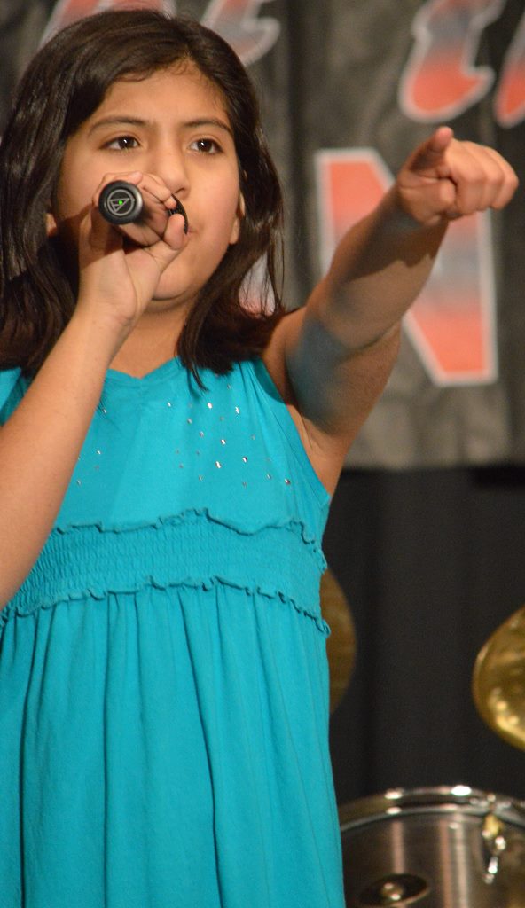 A SECOND MEMBER of the show's opening foursome, Victoria Navarrate, also presented a vocal solo in the program, "Set Fire to the Rain." Last year, as fourth-grader, Victoria was named the competition champ, singing another Adele song, "Set Fire to the Rain."